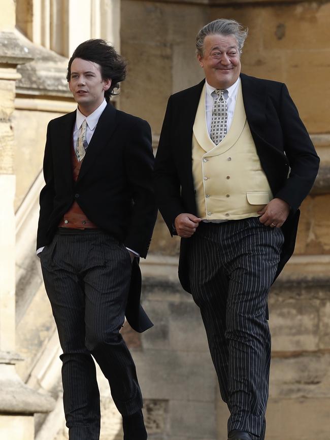 Stephen Fry arrives with his husband Elliott Spencer. Picture: AP