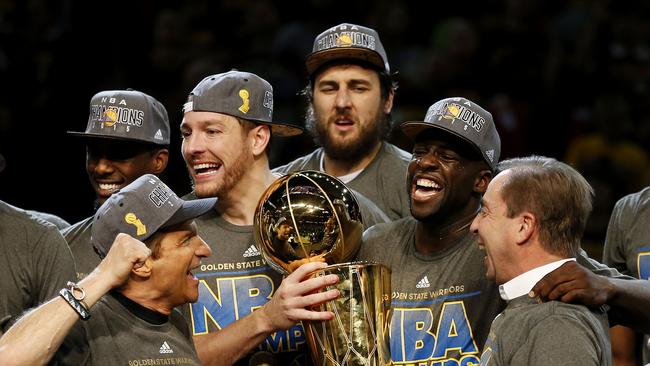 Andrew Bogut (top centre) celebrates Golden State’s NBA championship win in 2015 with teammates Draymond Green, David Lee and franchise owners Peter Guber and Joe Lacob.