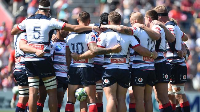 Rebels players gather in a huddle before the Super Rugby match between Japan's Sunwolves and Australia's Melbourne Rebels at Chichibunomiya stadium in Tokyo on May 25, 2019. (Photo by CHARLY TRIBALLEAU / AFP)