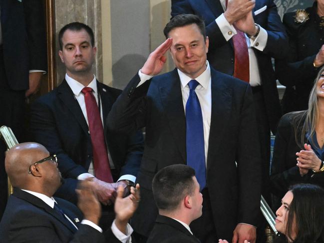 TOPSHOT - Elon Musk stands as he is recognized by US President Donald Trump during Trump's address to a joint session of Congress at the US Capitol in Washington, DC, on March 4, 2025. (Photo by SAUL LOEB / AFP)