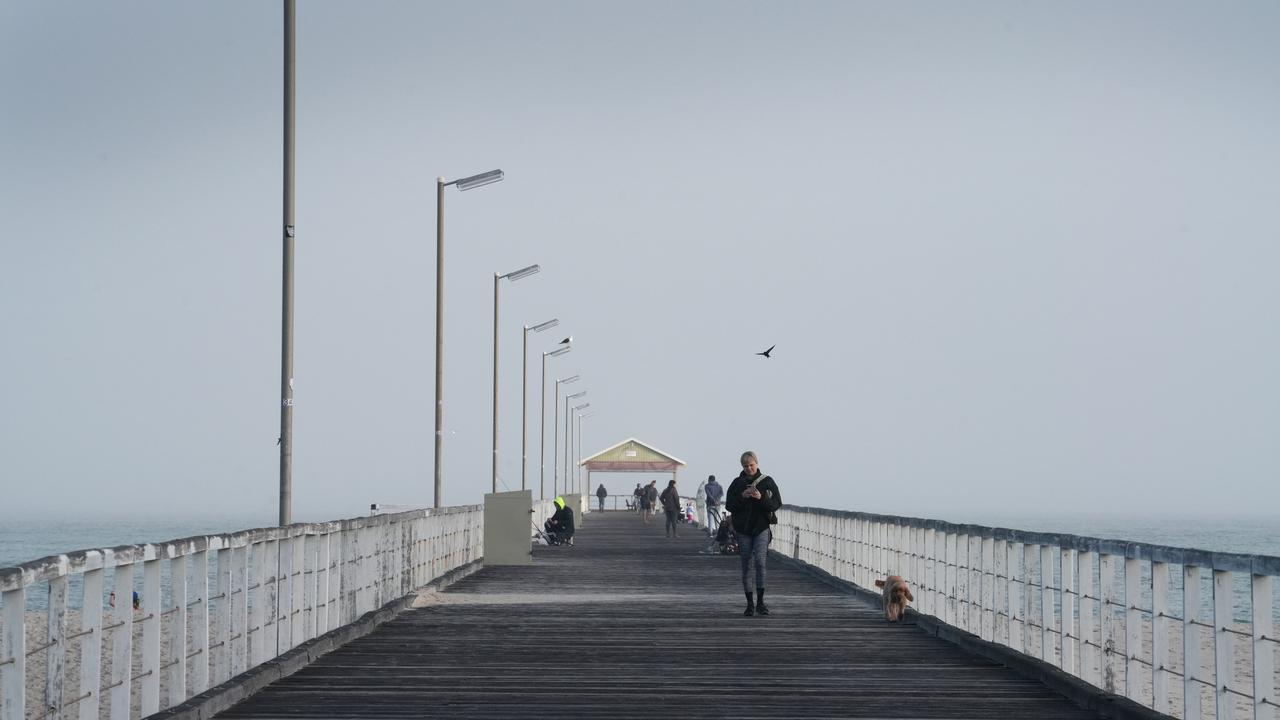 Most parts of Adelaide were shrouded in heavy fog for much of the morning. The jetty at Semaphore was shrouded at 9.30am. Picture: Dean Martin