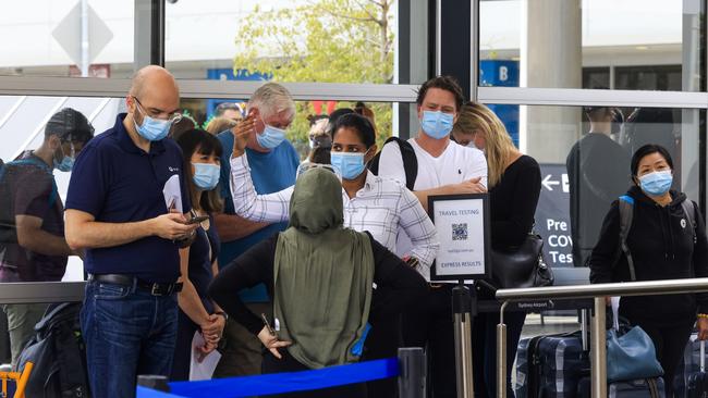 People line up at the Histopath pre-departure COVID testing clinic at Sydney International airport on Thursday. Picture: Jenny Evans/Getty Images