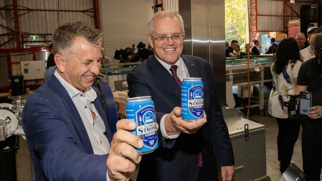 Prime Minister Scott Morrison with a can of ‘ScoMo’s Strong Economy’. Picture: Jason Edwards