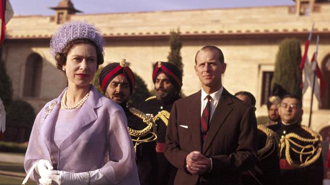 Queen Elizabeth II and the Duke of Edinburgh at a civic ceremony in New Delhi during the Royal Tour of India, in 1961. Picture: Getty Images.