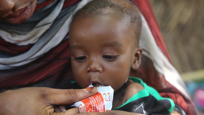 Manahil feeds her 6-month-old son Baraa with ready-to-use-therapeutic food at home in Ad-Damazin, Blue Nile state in his bid to recover from severe acute malnutrition. Picture: UNICEF