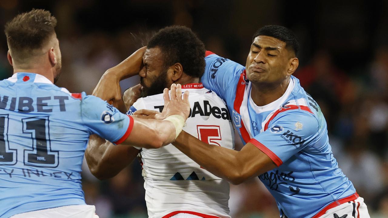 Mikaele Ravalawa of the Dragons is hit with a head high tackle from Daniel Tupou. AAP Image/Mark Evans.