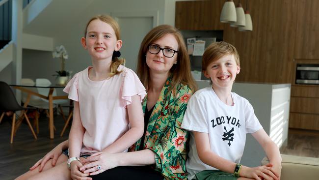 (L-R) 9 year old Charlotte her mum Khali and 11 year old brother Hunter Whatley, Ms Whatley has multiple sclerosisand is trying to get to Russia for an experimental drug. Picture: AAP Image/Angelo Velardo