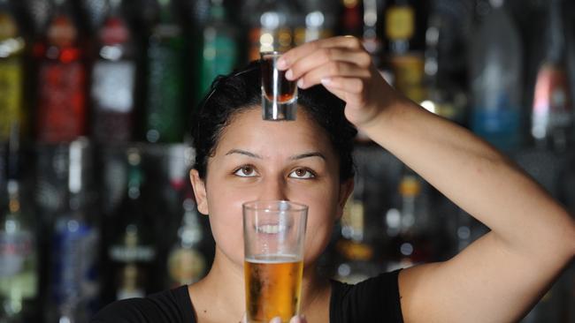 Bartender Jess Anderson mixes an energy drink with spirits.