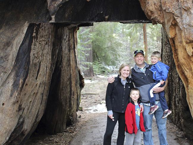 This May 2016 photo provided by Michael Brown shows Sebastian Bull, his wife Amy Bull, and their children Camden and Brady Bull, posing in the Pioneer Cabin tunnel tree, a giant sequoia that had a tunnel carved into it in the 1880s, during a visit to Calaveras Big Trees State Park near Arnold, Calif. The tree was toppled over by a massive storm Sunday, Jan. 8, 2017. Four generations of Brownâ€™s family have spent countless hours at the tree and often took out-of-town visitors there, some from as far away as Turkey. (Michael Brown via AP)