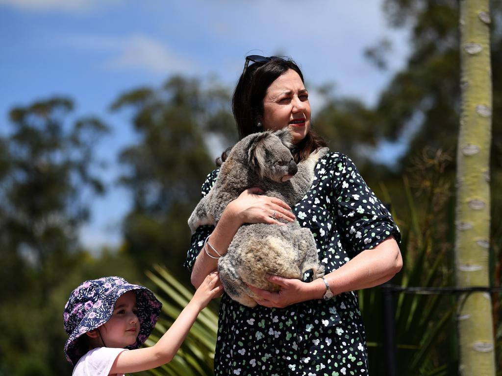 Queensland Premier Annastacia Palaszczuk, joined by her four-year-old niece Emma, holds a koala during a visit to Australia Zoo on the Sunshine Coast. Picture: NCA NewsWire / Dan Peled