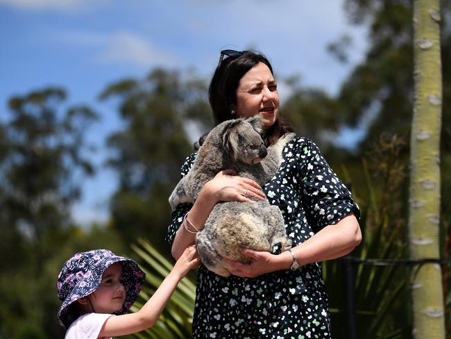 Queensland Premier Annastacia Palaszczuk, joined by her four-year-old niece Emma, holds a koala during a visit to Australia Zoo on the Sunshine Coast. Picture: NCA NewsWire / Dan Peled