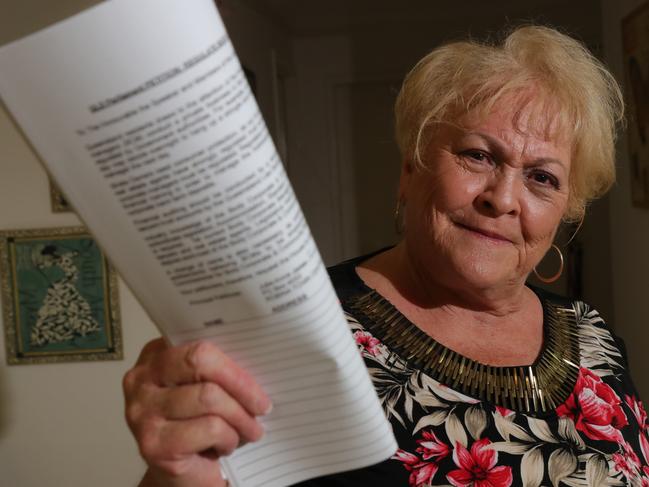 Julie-Anne James at her Merrimac home, ready to petition calling for more regulation in the industry. She is the head of Strata owners speak out. Picture Glenn Hampson