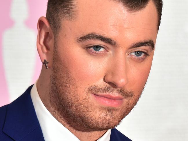 British singer Sam Smith poses on the red carpet to attend the BRIT Awards 2015 in London on February 25, 2015. AFP PHOTO / LEON NEAL RESTRICTED TO EDITORIAL USE, TO ILLUSTRATE THE EVENT AS SPECIFIED IN THE CAPTION, NO USE IN PUBLICATION DEVOTED TO SINGLE PERFORMER