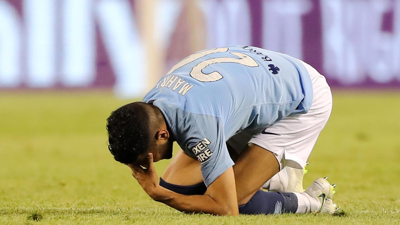 Riyad Mahrez of Manchester City reacts to an injury in the first half.