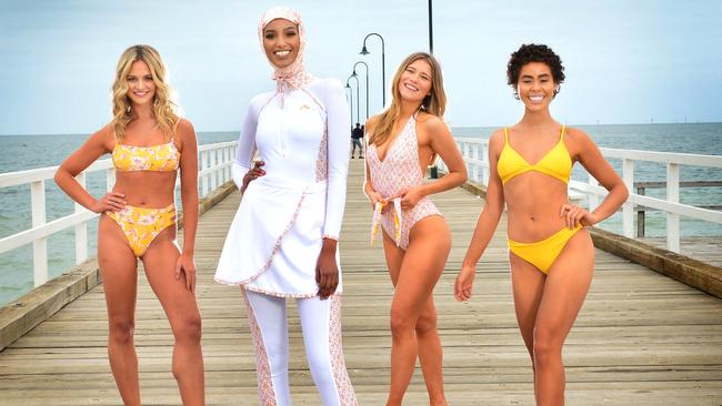 Four of the national finalists in the Miss Universe Australia competition showcasing the new swimsuit collection being used by the competition. Picture: Nicki Connolly