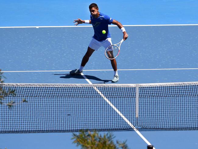 Tennis player Thiago Monteiro of Brazil hits a return during a practice session, allowed while serving quarantine for two weeks, in Melbourne on January 20, 2021, ahead of the Australian Open tennis tournament. (Photo by William WEST / AFP) / -- IMAGE RESTRICTED TO EDITORIAL USE - STRICTLY NO COMMERCIAL USE --