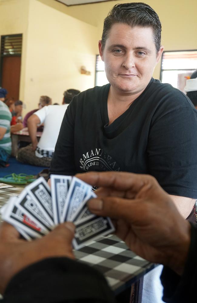 Renae Lawrence joins the other inmates in a Balinese card competition called "Ceki" to celebrate Indonesia's Independence Day. Picture: Lukman Bintoro/ News Corp Australia