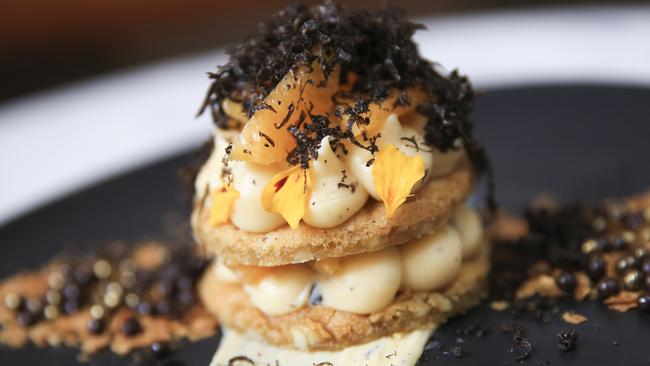 Cookies and Cream dessert at Three Williams, Redfern. Macadamia cookie, truffled mandarin creme patisserie, fresh mandarin, gold dust feulletine, dark choc crispearls and shaved truffle. Picture: Dylan Robinson