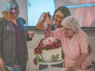 CONGRATS: Isabell Webb, 102, cuts the cake. Picture: Contributed