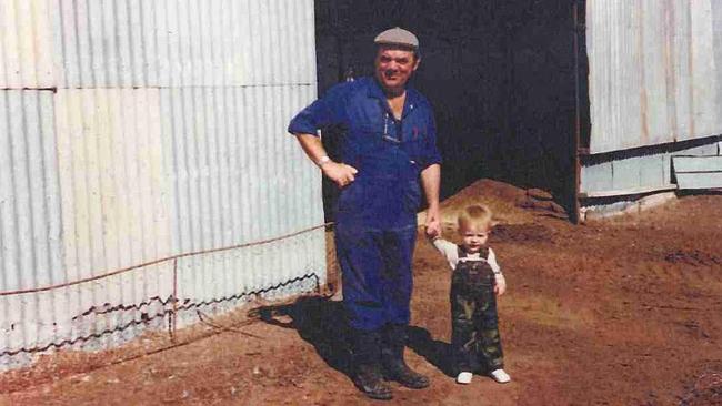 An infant Daniel Shoppee with his grandfather Art at the Nhill duck hatchery.