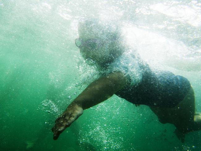 A Portrait of Australia: The best stories from 30 years of Australian Geographic. Despite its distance from the ocean, Jindabyne’s 60-odd Yabbies train in the dam’s cool, fresh waters. They are linked to Tathra on the NSW south coast and visit to compete in surf carnivals a couple of times a year. Photo by Frances Mocnik.