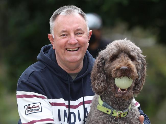 Grayham Bottomley was treated for an enlarged prostate and now problem solved. Grayham on a daily walk with his dog Molly at the park.                                                             Picture: David Caird