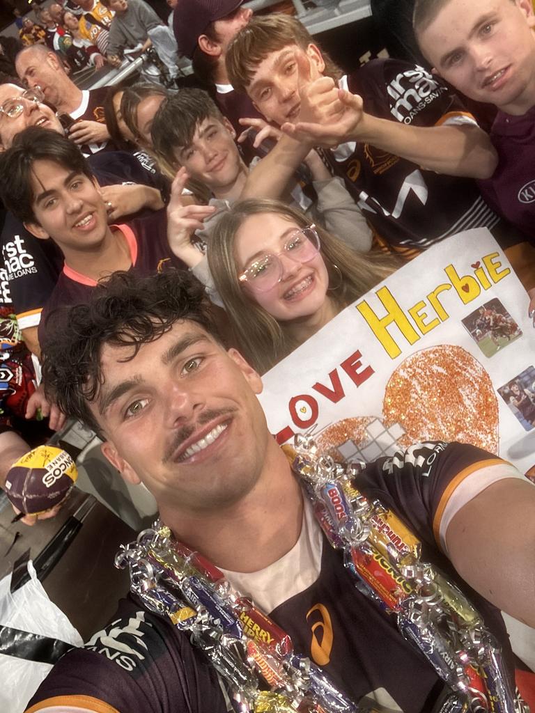 Herbie Farnworth with Broncos fans.