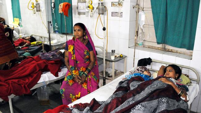 Indian women who underwent sterilization surgeries receive treatment at the CIMS hospital in Bilaspur, in the central Indian state of Chhattisgarh, Tuesday, Nov. 11, 2014. Eight Indian women have died and more than a dozen others in critical condition Tuesday after undergoing sterilization surgeries in a free government-run program to help slow the country's population growth. A total of 83 women, all poor villagers under the age of 32, had the operations Saturday in a hospital outside Bilaspur city. Each of the women had received a payment of 600 rupees, or about $10, to participate in the program, said the state's chief medical officer, Dr. S.K. Mandal. (AP Photo)