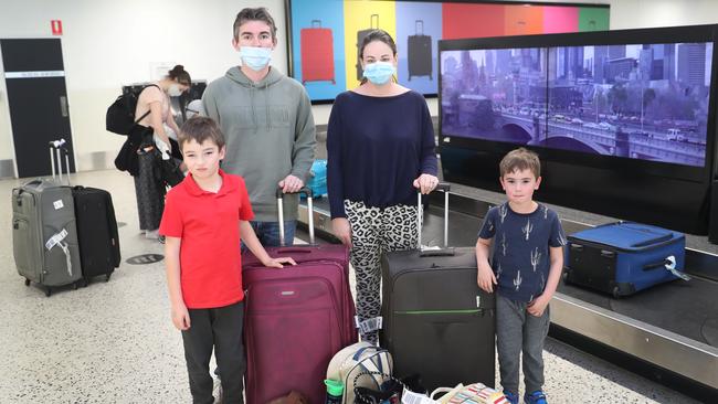 Anna and Nick Martin with sons William and Mitchell back from the Gold Coast must now quarantine at home. Picture: David Crosling