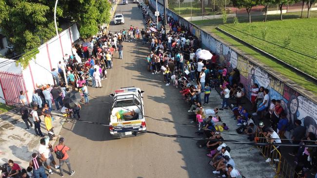 Migrants line up at a migration station in Tapachul, Chiapas state in Mexico. Picture: Juan Manuel Blanco/EPA/The Times