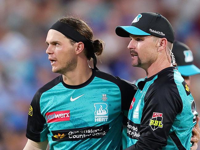 ADELAIDE, AUSTRALIA - JANUARY 11: Mitch Swepson of the Heat celebrates the bowling wicket of Jamie Overton of the Strikers for 6 runs with Colin Munro of the Heat during the BBL match between Adelaide Strikers and Brisbane Heat at Adelaide Oval, on January 11, 2025, in Adelaide, Australia. (Photo by Sarah Reed/Getty Images)