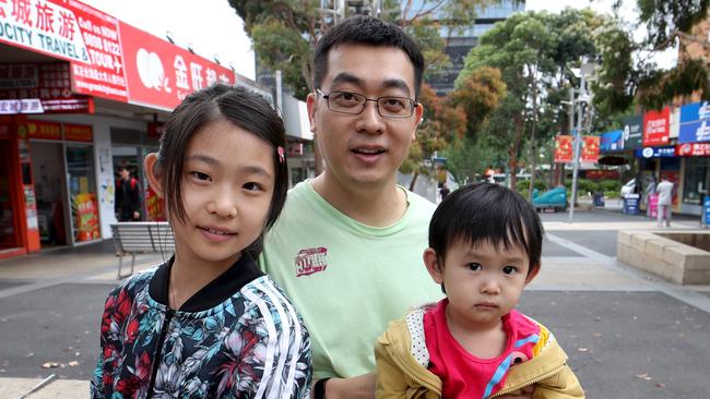 Debut voter Yuval Xie, with daughters Isabella and Bella, says sustainable migration is key. Picture: David Geraghty 