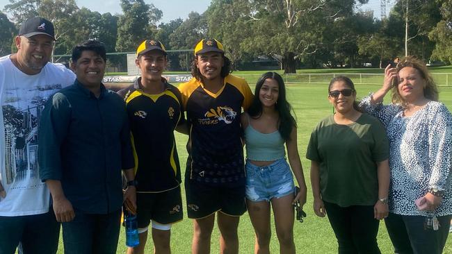 Monash Tigers first-gamers Yash Pednekar and Jono D'Rozario with their families before the match against Dandenong.