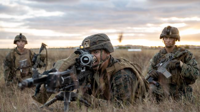 A US marine directs fire during an assault on Bowen Airport in Queensland, on Exercise Talisman Sabre 2021, the largest bilateral training activity between Australia and the United States, held every two years.