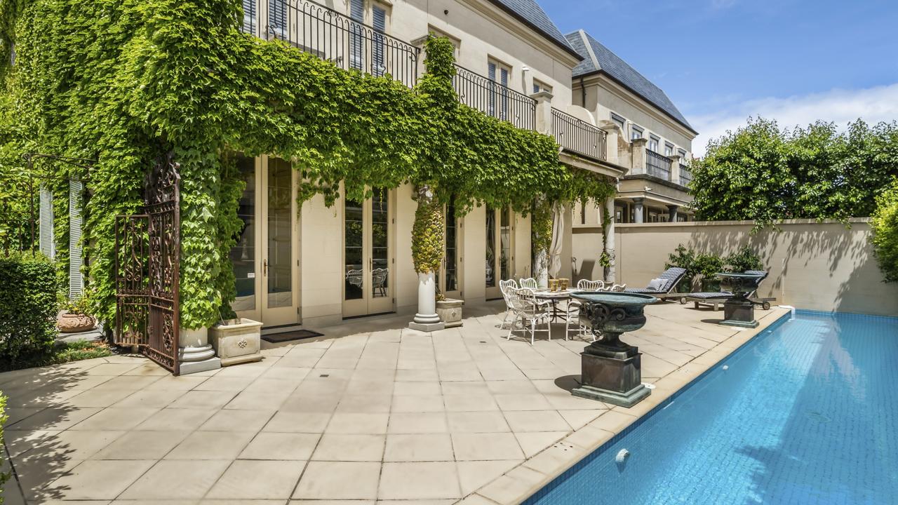 French luxury meets Brighton living — this chateau-style mansion boasts a 16m-long solar-heated pool and lush gardens.