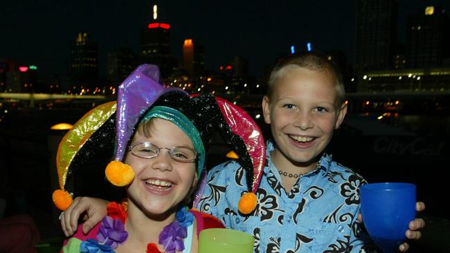 31 Dec 2003 New Year's Eve celebrations at South Bank, Brisbane. Caitlin 6yrs and Zachary 8yrs Skinner from /Bracken /Ridge picdavid/kelly children jester's party hat lei