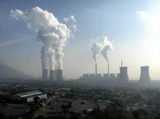 Smoke and steam are discharged from chimneys and cooling towers at a coal-fired power plant in Jiyuan city, central China's Henan province, 30 October 2016. Picture: Wen Jie