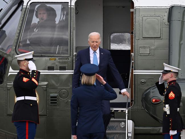 US President Joe Biden is welcomed by US Air Force Colonel Angela Ochoa on arrival to board Air Force One at Joint Base Andrews in Maryland. Picture: AFP