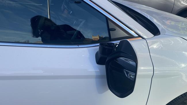 A 50-year-old man of no fixed address has been arrested for allegedly snapping the mirrors on nine cars at a car dealership in the city.