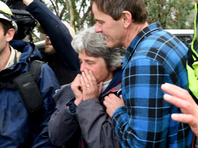 Luke’s emotional parents watch as he’s taken to the ambulance. Picture: Mike Keating