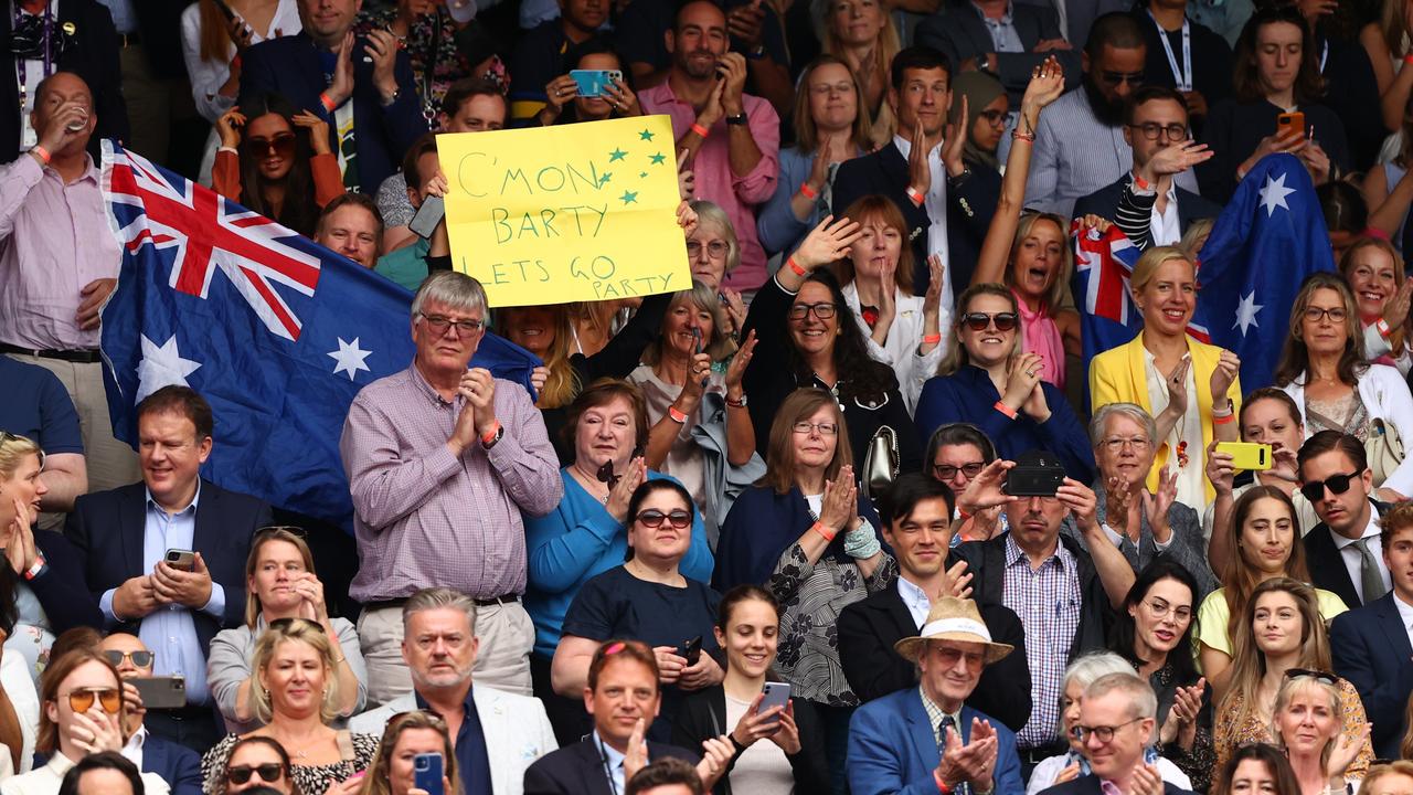 LONDON, ENGLAND - JULY 10: Spectators wave an Australia flag and sign in support of Ashleigh Barty of Australia after winning her Ladies' Singles Final match against Karolina Pliskova of The Czech Republic on Day Twelve of The Championships - Wimbledon 2021 at All England Lawn Tennis and Croquet Club on July 10, 2021 in London, England. (Photo by Julian Finney/Getty Images)