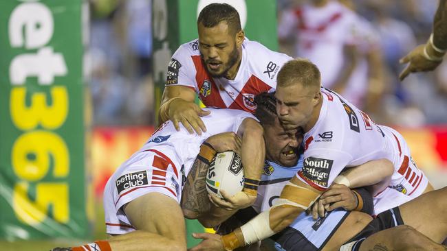 Andrew Fifita of the Sharks is held up over the line during the Round 2 NRL match between the Cronulla Sutherland Sharks and St George-Illawarra Dragons at Southern Cross Group Stadium in Sydney, Thursday, March 15, 2018. (AAP Image/Craig Golding) NO ARCHIVING, EDITORIAL USE ONLY