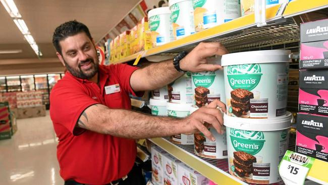 NEW OPTIONS: Coles Riverlink store manager Jamie Andrews stocks bulk goods on the shelves of the North Ipswich store. Picture: Rob Williams