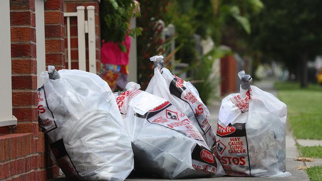 Bags of hazardous waste marked asbestos outside a property. Picture: Alison Wynd