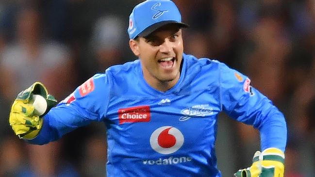 ADELAIDE, AUSTRALIA - JANUARY 21: Alex Carey of the Strikers celebrates after catching the wicket of  Joe Burns of the Heat during the Big Bash League match between the Adelaide Strikers and the Brisbane Heat at Adelaide Oval, on January 21, 2021, in Adelaide, Australia. (Photo by Mark Brake/Getty Images)