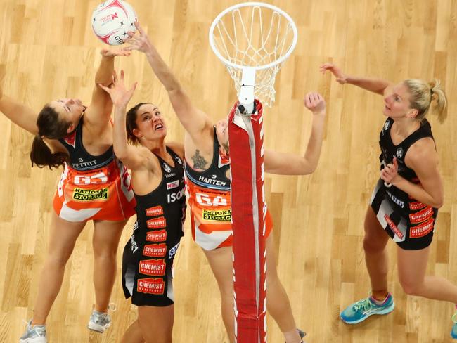 MELBOURNE, AUSTRALIA - JULY 29:  Jo Harten of the Giants and Sharni Layton of the Magpies compete for the ball  during the round 13 Super Rugby match between the Magpies and the Giants at Hisense Arena on July 29, 2018 in Melbourne, Australia.  (Photo by Scott Barbour/Getty Images)
