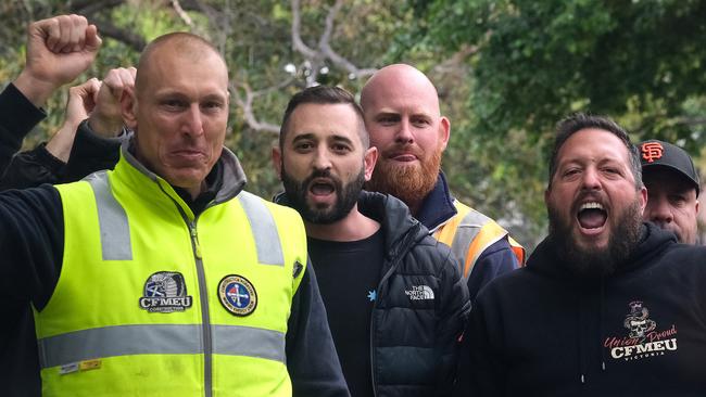 CFMEU members protest outside a Liberal Party press conference in Melbourne. Picture: Luis Enrique Ascui