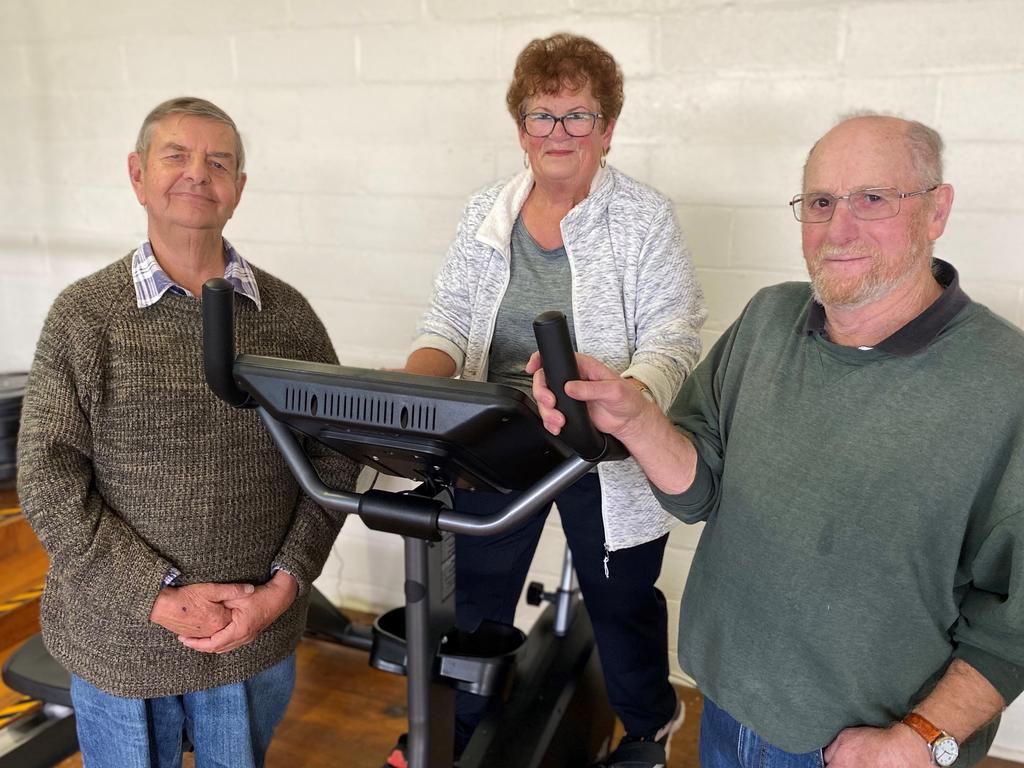 Flinders Island residents Andrew Jackson, Pauline Blyth and Rodney Pitchford use the gym and equipment supplied by Royal Flying Doctor Service funding.