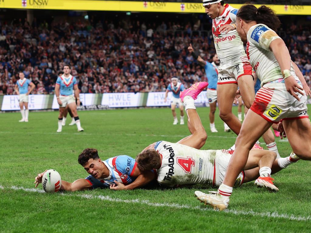 Joseph-Aukuso Suaalii beats the efforts of Zac Lomax to score a try. Picture: Cameron Spencer/Getty Images