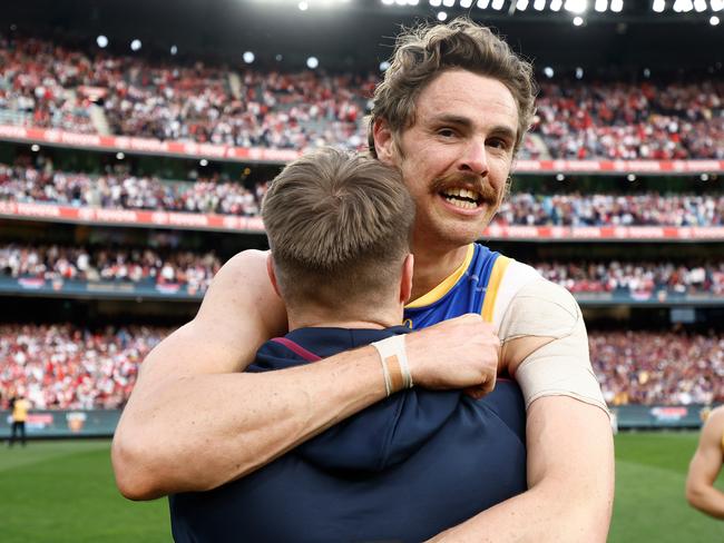 MELBOURNE, AUSTRALIA - SEPTEMBER 28: Lincoln McCarthy (left) and Joe Daniher of the Lions celebrate during the 2024 AFL Grand Final match between the Sydney Swans and the Brisbane Lions at The Melbourne Cricket Ground on September 28, 2024 in Melbourne, Australia. (Photo by Michael Willson/AFL Photos via Getty Images)